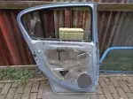 Opel corsa D levé zadní dveře